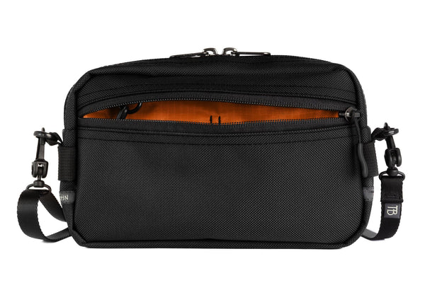 A Side Effect in Black Ballistic with Persimmon (dark orange with orange grid) 210 Cerylon interior.